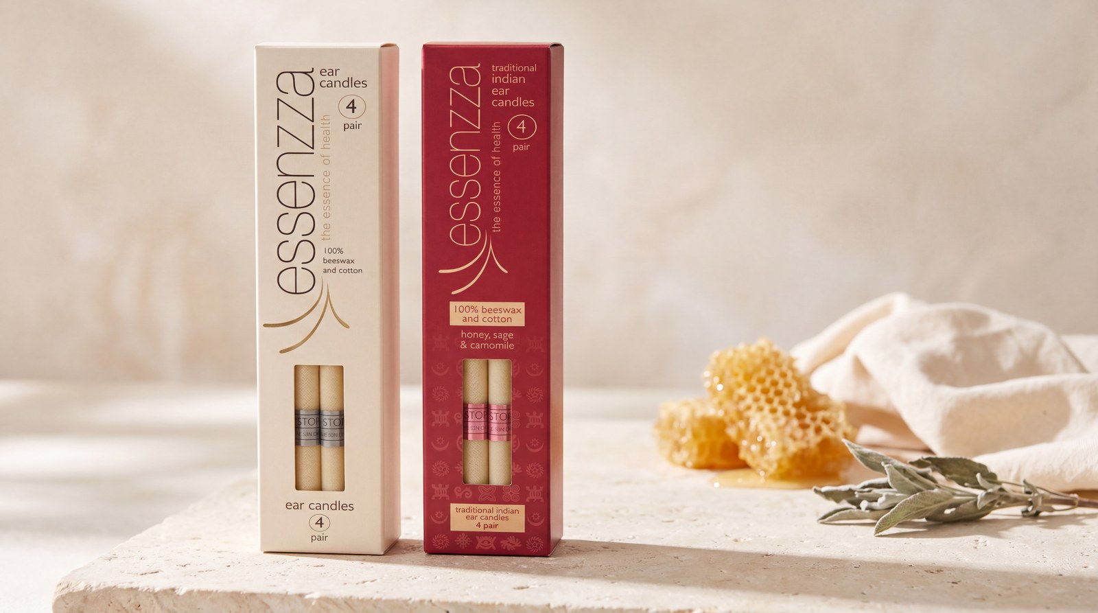 Essenzza Original and Traditional Indian ear candle packs beside natural honeycomb and dried sage.